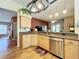Well-lit kitchen with stainless steel appliances, granite countertops, and hardwood flooring, open to living spaces at 748 Andover Cir, Winter Springs, FL 32708