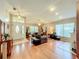 Spacious living room featuring a high ceiling, wood floors, a fireplace and large windows with natural light at 748 Andover Cir, Winter Springs, FL 32708