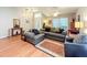 Comfortable living room with hardwood floors and stylish furniture, illuminated by natural light from large windows at 748 Andover Cir, Winter Springs, FL 32708