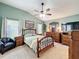 Inviting main bedroom with a ceiling fan, carpeted floors, a large window, and ample closet space at 748 Andover Cir, Winter Springs, FL 32708