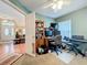 Home office featuring desk setup and keyboard, with entry view to front door and living room at 748 Andover Cir, Winter Springs, FL 32708