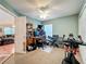 Home office featuring desk setup and keyboard, with exercise bike in the corner of the room at 748 Andover Cir, Winter Springs, FL 32708