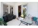 Covered back patio with sliding glass doors and table and chairs, plants, and backyard at 748 Andover Cir, Winter Springs, FL 32708
