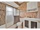 Well-maintained bathroom with glass shower door, modern vanity, and decorative backsplash at 7807 Pine Hawk Ln, Orlando, FL 32822