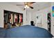 Bedroom features a ceiling fan, walk-in closet, and easy access to the rest of the house at 7807 Pine Hawk Ln, Orlando, FL 32822