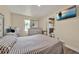 Bright bedroom featuring a large dresser, television, mirror, and ensuite bathroom at 7807 Pine Hawk Ln, Orlando, FL 32822