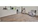 Spacious living room featuring wood-look floors and ample natural light at 7807 Pine Hawk Ln, Orlando, FL 32822