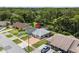 Aerial view of home in a residential neighborhood with a brick driveway at 8116 Parrot Dr, Orlando, FL 32825