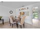 Bright dining area featuring stylish furnishings and easy access to the kitchen and screened lanai at 8116 Parrot Dr, Orlando, FL 32825