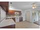 Spacious kitchen featuring tile floors, white appliances, and ample counter space at 8116 Parrot Dr, Orlando, FL 32825
