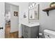 Elegant bathroom with a single vanity, modern fixtures, and a view to the hallway at 8248 Marbella View Ct, Orlando, FL 32817