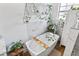 Spa-like bathroom featuring a freestanding tub, decorative greenery, and a tranquil ambiance at 8248 Marbella View Ct, Orlando, FL 32817