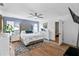 Spacious primary bedroom featuring hardwood floors, a ceiling fan, and a comfortable rug at 8248 Marbella View Ct, Orlando, FL 32817