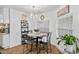 Bright dining area featuring a modern chandelier, stylish table, and large window at 8248 Marbella View Ct, Orlando, FL 32817