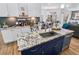 Spacious kitchen island with a stainless steel sink, granite counters and storage cabinets at 8248 Marbella View Ct, Orlando, FL 32817