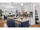 Kitchen with stainless steel appliances and center island that overlooks the dining room at 8248 Marbella View Ct, Orlando, FL 32817