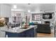 Modern kitchen with granite counters, stainless steel appliances and a large island with seating at 8248 Marbella View Ct, Orlando, FL 32817