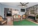 Cozy screened lanai with stone wall fireplace, perfect for outdoor relaxation at 8248 Marbella View Ct, Orlando, FL 32817