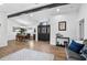 Open living room featuring wood floors and an arched doorway at 8248 Marbella View Ct, Orlando, FL 32817