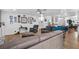Open living space with wood floors, modern furniture, and bright white walls decorated with Gathering photos at 8248 Marbella View Ct, Orlando, FL 32817