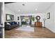 Open living room showcasing wood flooring and sliding door to outside patio at 8248 Marbella View Ct, Orlando, FL 32817