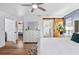 Spacious main bedroom with wood-look floors, ensuite access, and walk-in closet at 8248 Marbella View Ct, Orlando, FL 32817
