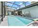 Inviting pool and deck area with full screen enclosure for outdoor enjoyment at 8248 Marbella View Ct, Orlando, FL 32817