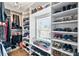 Well-organized walk-in closet featuring custom shelving and ample storage at 8248 Marbella View Ct, Orlando, FL 32817