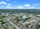 This aerial shows the home with beautiful views of the adjacent lake at 826 Long Bay Ct, Kissimmee, FL 34741