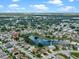 A high aerial shows the community pool near the lake at 826 Long Bay Ct, Kissimmee, FL 34741