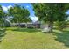 Serene backyard with mature trees and ample green space, offering a peaceful retreat at 826 Long Bay Ct, Kissimmee, FL 34741