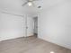 Bright bedroom featuring hardwood floors, closet and a view into a nearby room at 826 Long Bay Ct, Kissimmee, FL 34741