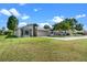 Single-story home featuring a well-manicured lawn and a two-car garage at 826 Long Bay Ct, Kissimmee, FL 34741