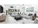 Bright and airy living room with modern furnishings and a large sliding glass door to the patio at 826 Long Bay Ct, Kissimmee, FL 34741