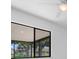 The screened-in patio offers a seamless transition to the outdoors with views of the lush landscaping at 826 Long Bay Ct, Kissimmee, FL 34741