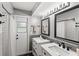 Modern bathroom featuring double sinks, subway tile shower, and stylish fixtures at 8308 Granada Blvd, Orlando, FL 32836