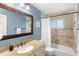 Bathroom featuring vanity with granite countertop, tile flooring, and shower with tub at 8308 Granada Blvd, Orlando, FL 32836