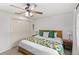 Bedroom with carpet, ceiling fan, closet, and bed with bedside tables at 8308 Granada Blvd, Orlando, FL 32836