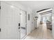 Bright foyer with tile flooring, white walls, and view into the living room at 8308 Granada Blvd, Orlando, FL 32836