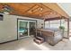 Hot tub in screened patio with wooden roof and easy access to sliding doors at 8308 Granada Blvd, Orlando, FL 32836