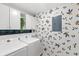 Laundry room with white cabinets, modern washer and dryer set, and neutral counters at 8308 Granada Blvd, Orlando, FL 32836