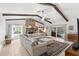 Spacious living room with vaulted ceilings, exposed beams, and a stone fireplace at 8308 Granada Blvd, Orlando, FL 32836