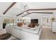 Open-concept living room with a large sectional sofa and seamless flow to the pool area at 8308 Granada Blvd, Orlando, FL 32836