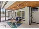 Covered outdoor seating area with views of the pool, wooden roof, and exterior lighting at 8308 Granada Blvd, Orlando, FL 32836