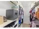 Organized walk-in closet with shelving, hanging space, and built-in safe at 8308 Granada Blvd, Orlando, FL 32836