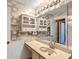 This bathroom features a vanity, a mirror and a white wall with nautical wallpaper at 887 Reedy Cv, Casselberry, FL 32707