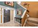 Bright entryway featuring tile floors, staircase, and decorative table, creating a warm welcome at 887 Reedy Cv, Casselberry, FL 32707