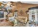 Cozy living room with high ceilings, decorative accents, and ample natural light at 887 Reedy Cv, Casselberry, FL 32707