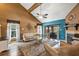 Comfortable living area with fireplace, sleek flooring, and access to a screened patio at 887 Reedy Cv, Casselberry, FL 32707