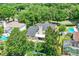 Rear aerial showcasing the private backyard and back architecture with mature landscaping at 991 Hawthorne Cove Ct, Ocoee, FL 34761